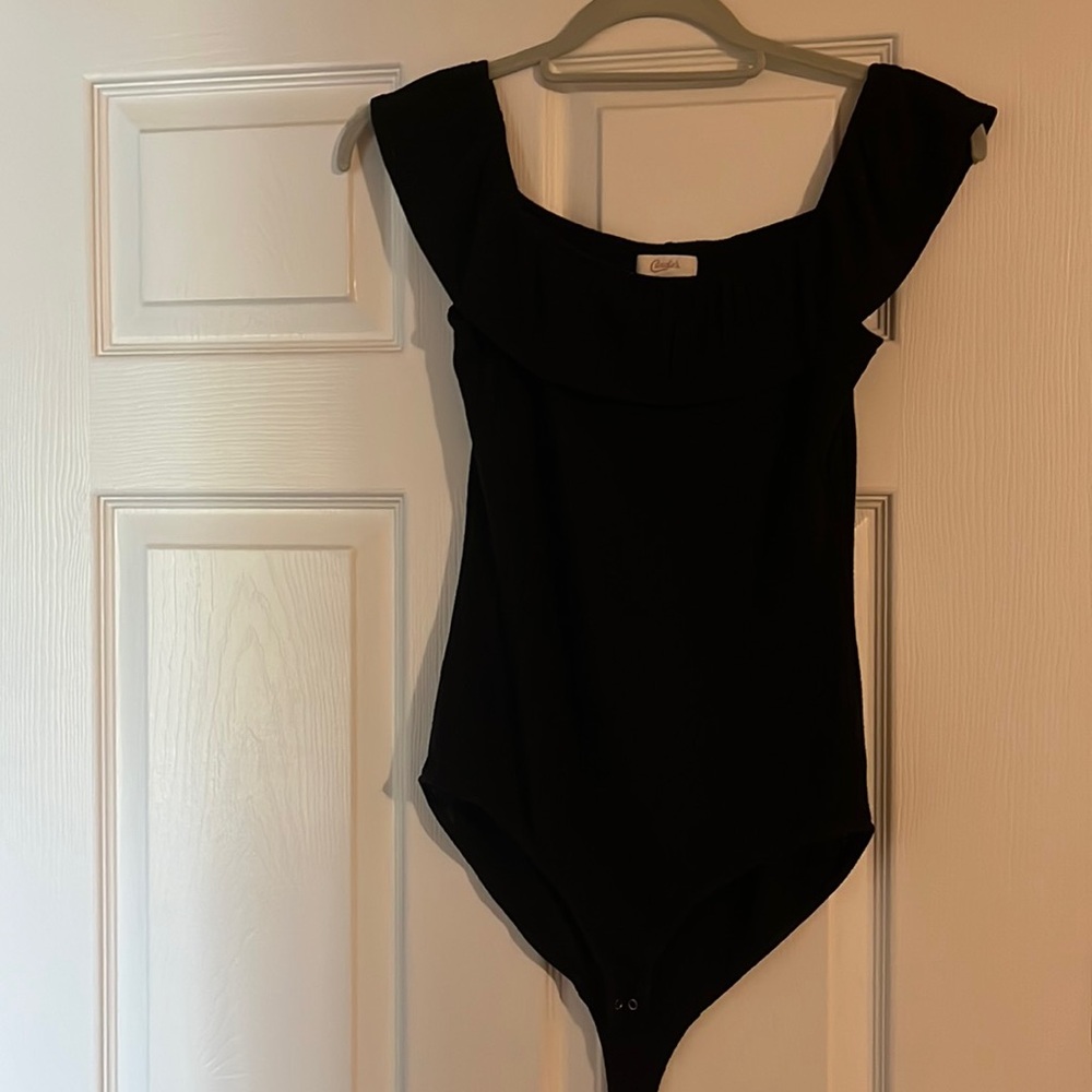 Black, ribbed material body suit. Can be worn off shoulders